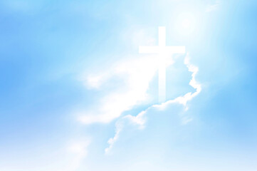 Christian cross appears bright in the sky background and soft clouds. with the light shining as...