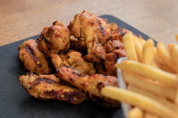 Chicken Wings with chips on the side.
