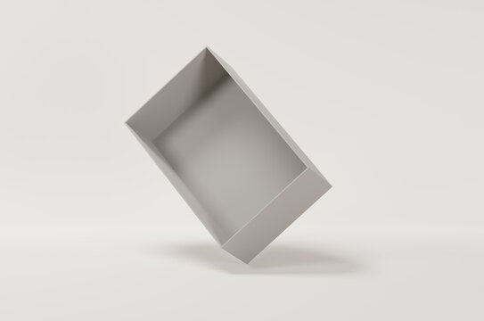 White empty packing cardboard box in the air on a white background. Shoe or gift box mock up.