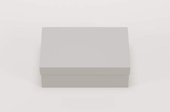 White empty packing cardboard box on a white background. Shoe or gift box mock up. Top view.