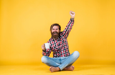 best day. drinking tea or coffee. good morning. morning vibes at home. concept of inspiration. hipster man drink coffee. handsome bearded man holding a white cup. mug with beverage