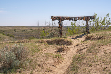 Old cowboy boots nailed to a rail in the Great Sandhills (Sand Hills) near Sceptre, Saskatchewan, Canada
