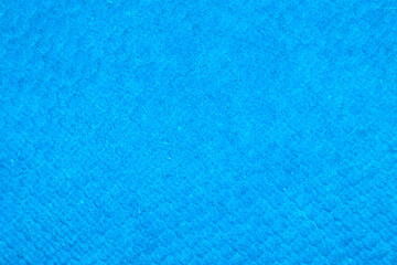 Obraz na płótnie Canvas Grainy detailed blue paper texture and grunge surface background close-up