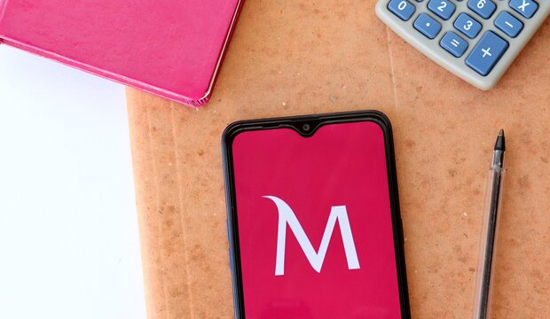 Bahia, Brazil. November 6, 2020: Millennium Bcp Bank App on smartphone screen on office desk. Portuguese Bank. App Millennium.