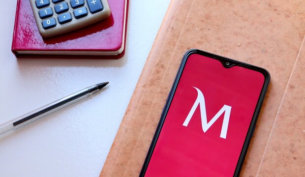 Bahia, Brazil. November 6, 2020: Millennium Bcp Bank App on smartphone screen on office desk. Portuguese Bank. App Millennium. Private bank from Portugal.