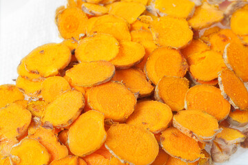 Thinly sliced raw turmeric root