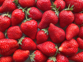 Flatlay from a large number of strawberries. Natural background.
