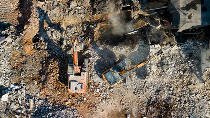 Excavator demolish building. View from above