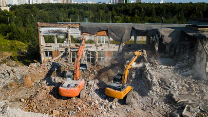 Excavator demolish building. View from above
