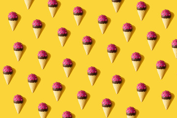 Creative summer pattern made with ice cream on yellow background. Minimal flat lay.