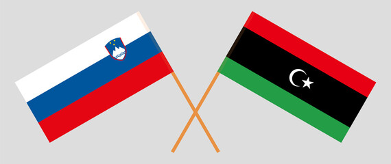 Crossed flags of Slovenia and Libya. Official colors. Correct proportion