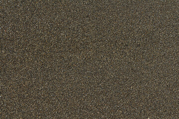 Dark wet gravel sea sand pebbles. Background texture of natural small pebbles.