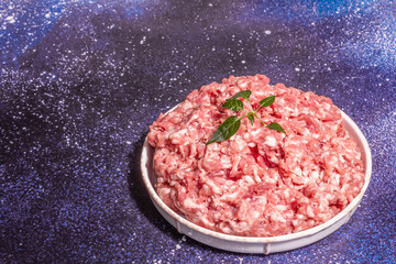 Raw pork minced meat in a ceramic stand
