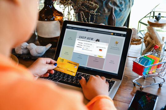 Concepts of online payment, ecommerce, shop secure and web stores. Asian woman adding credit card information to account with laptop computer for online shopping and payment