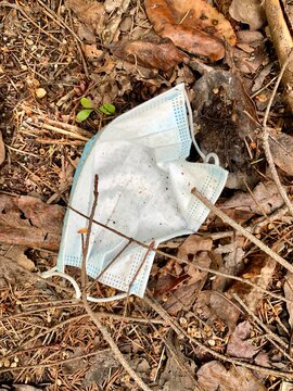 Used dirty medical face mark was left on ground