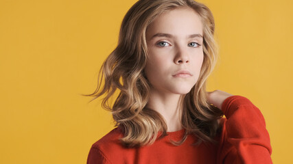 Portrait of wavy haired teenager girl looking confident isolated