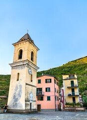 Fototapeta na wymiar Bell tower of San Lorenzo Church in Manarola at the Cinque Terre in Italy