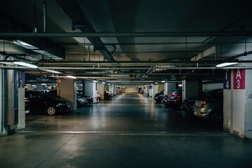 Inside underground car parking. Modern parking lots - obrazy, fototapety, plakaty