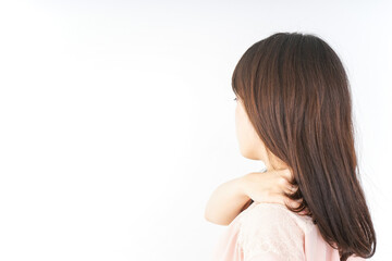 Obraz premium 肩こりを感じる若い女性