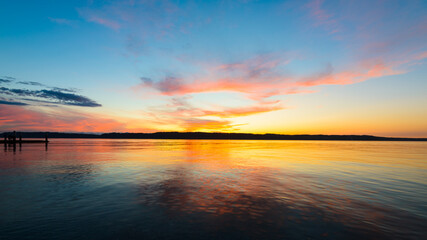 The sun sets over Puget Sound in western Washington State creating a background of pink and orange...