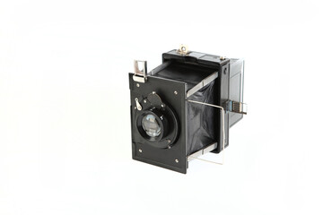 Old pre war large format scaling camera on white background.