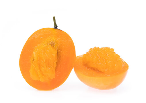 half of  Marian plum fruit isolated on white background Mayongchid or Maprang Marian Plum.