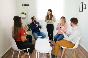 Diverse people feeling happy at group counseling