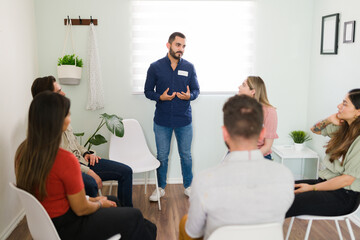 Man in his 20s introducing himself at AA
