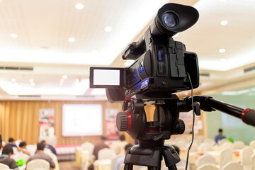 Video camera set record audience in conference hall seminar event. Company meeting, exhibition...