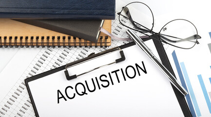 Text Acquisition on Office desk table with notebooks, supplies,analysis chart, on the white...