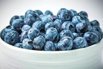 Bowl of Ripe Blueberries on white background