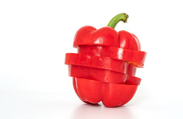 Sliced wet red pepper or Bell pepper on white background, slice and rearrange to original shape, front view image.