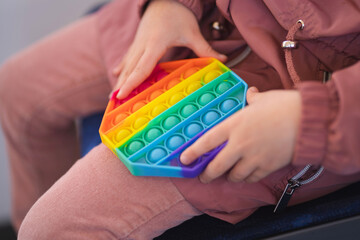 Rainbow Pop it fidget toy on a empty copy space background