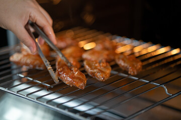 Home made chicken wings in spicy sauce prepare to cook in oven.