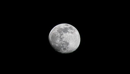 moon waning gibbous almost full black background