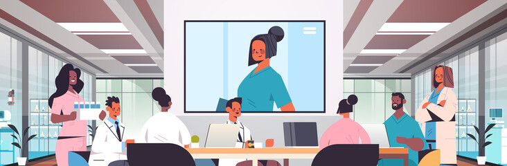team of doctors having video conference mix race medical professionals discussing at round table medicine healthcare