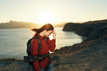 pretty woman with backpack travel rocky mountains nature fresh air