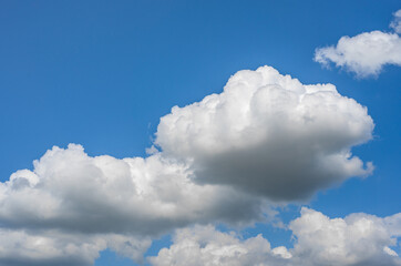Naklejka na ściany i meble Photo of some white whispy clouds and blue sky cloudscape. Beautiful blue sky and white clouds