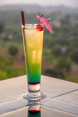 Cocktail near the swimming pool at sunset