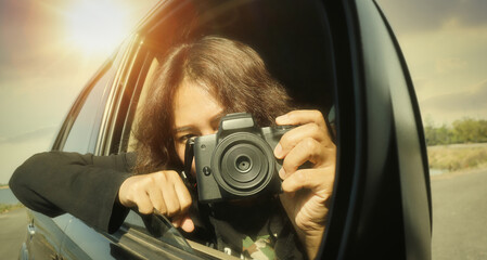 woman taking pictures in his car happy mood focus on camera