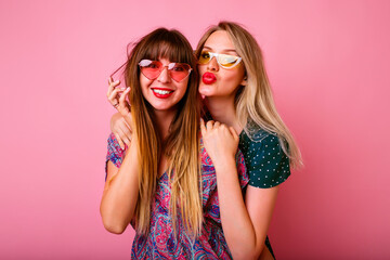Positive portrait of best friends hipster sister girls hugs smiling