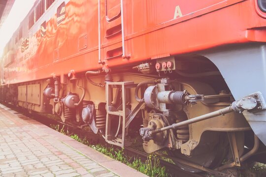 Red old passenger train lower parts.Train Mechanics.Lithuania railway industry.