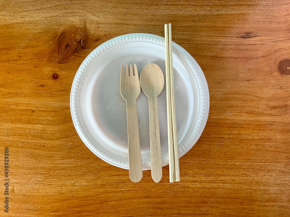 Wall mural fork, spoon and chopsticks on a plate