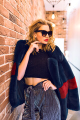 Indoor elegant portrait of young blonde sexy model