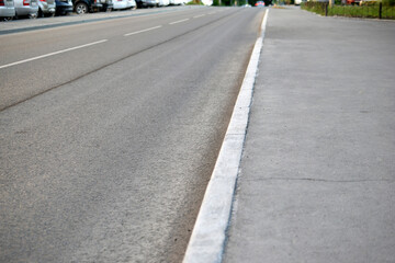 Asphalt road with markings and pedestrian crossing