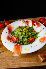 Rocket salad with dried Spanish ham