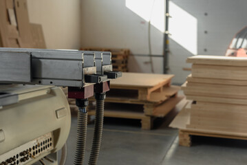 Closeup photo of automatic woodworking machine to produce furniture