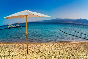 Entrance and sunshade to safe swimming area in the Red Sea in Eilat – famous tourist resort city in Israel, Middle East. Spherical panoramic view