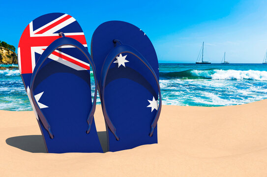 Flip flops with Australian flag on the beach. Australia resorts, vacation, tours, travel packages concept. 3D rendering