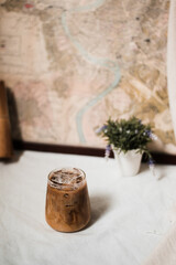 Close-up of iced coffee served on black table at cafe​